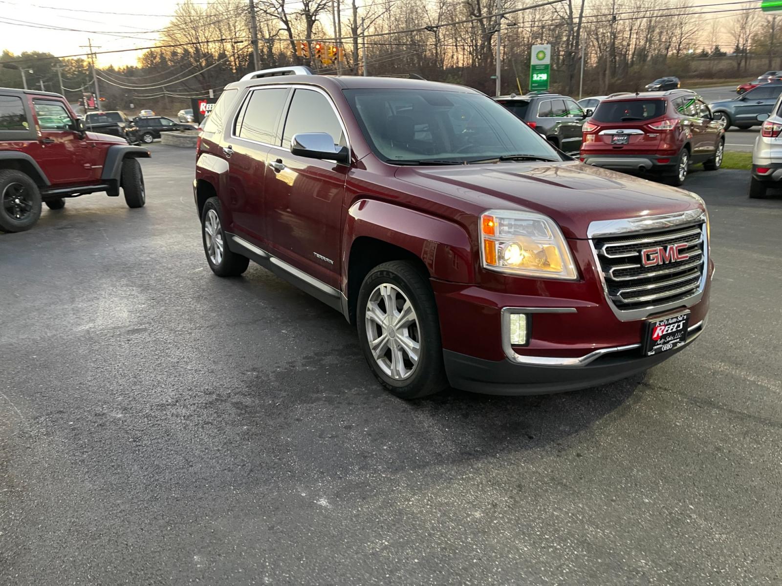 2016 Red /Black GMC Terrain SLT AWD (2GKFLUEK3G6) with an 2.4L I4 DOHC 16V engine, 6A transmission, located at 11115 Chardon Rd. , Chardon, OH, 44024, (440) 214-9705, 41.580246, -81.241943 - This 2016 GMC Terrain SLT AWD is a stylish and versatile SUV that offers a comfortable driving experience and plenty of features. With all-wheel drive, this vehicle is perfect for those who live in areas with harsh weather conditions. The 2.4-liter engine provides sufficient power and good fuel effi - Photo #2
